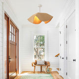Woven pendant light in bright entryway foyer