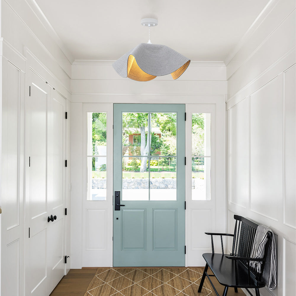 Woven pendant light in bright entryway foyer