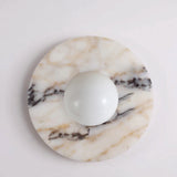 Marble wall sconce with natural stone veining