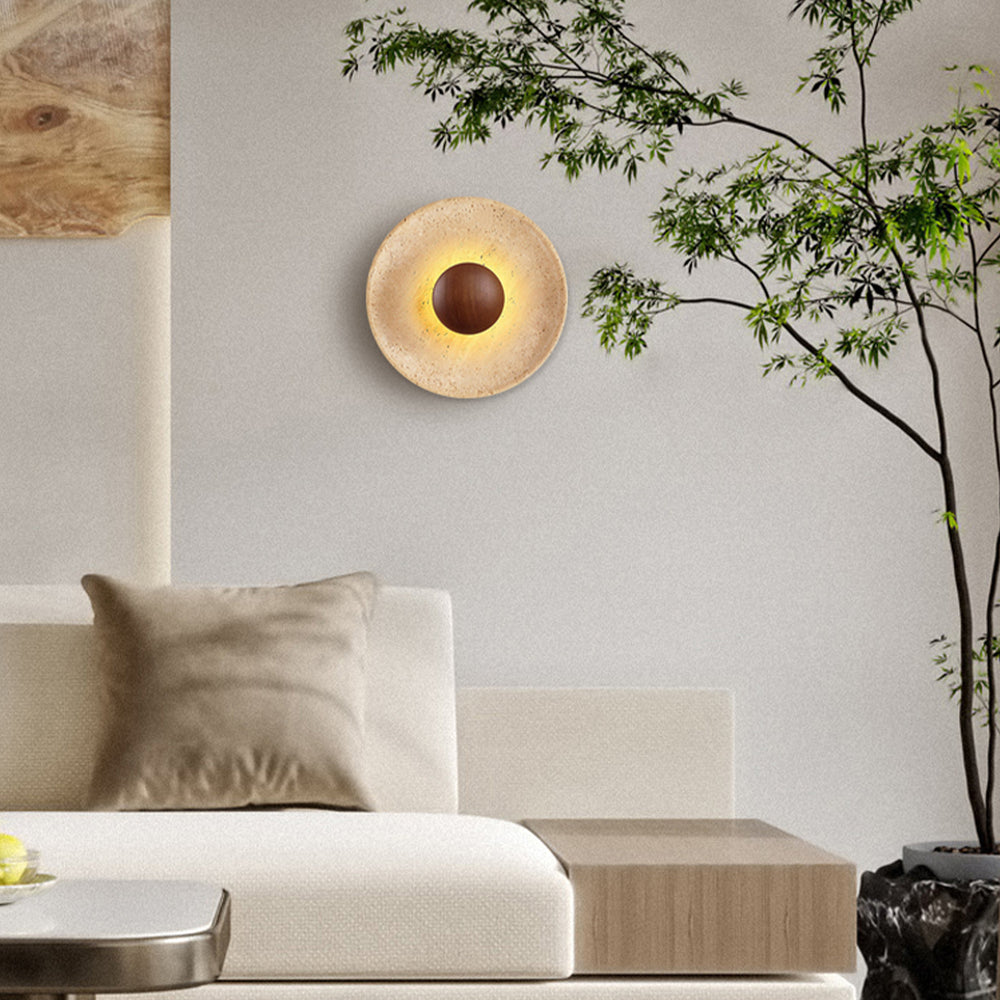 Natural travertine wall sconce with wood center in living room