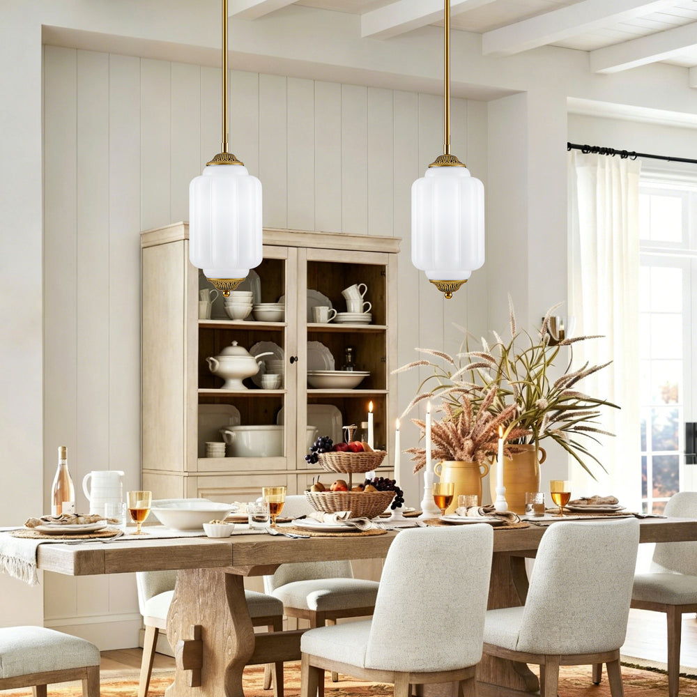 Two vintage white frosted glass pendant lights over farmhouse wooden dining table