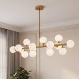 Front view modern gold alabaster globe linear pendant light indoor wall installation shot