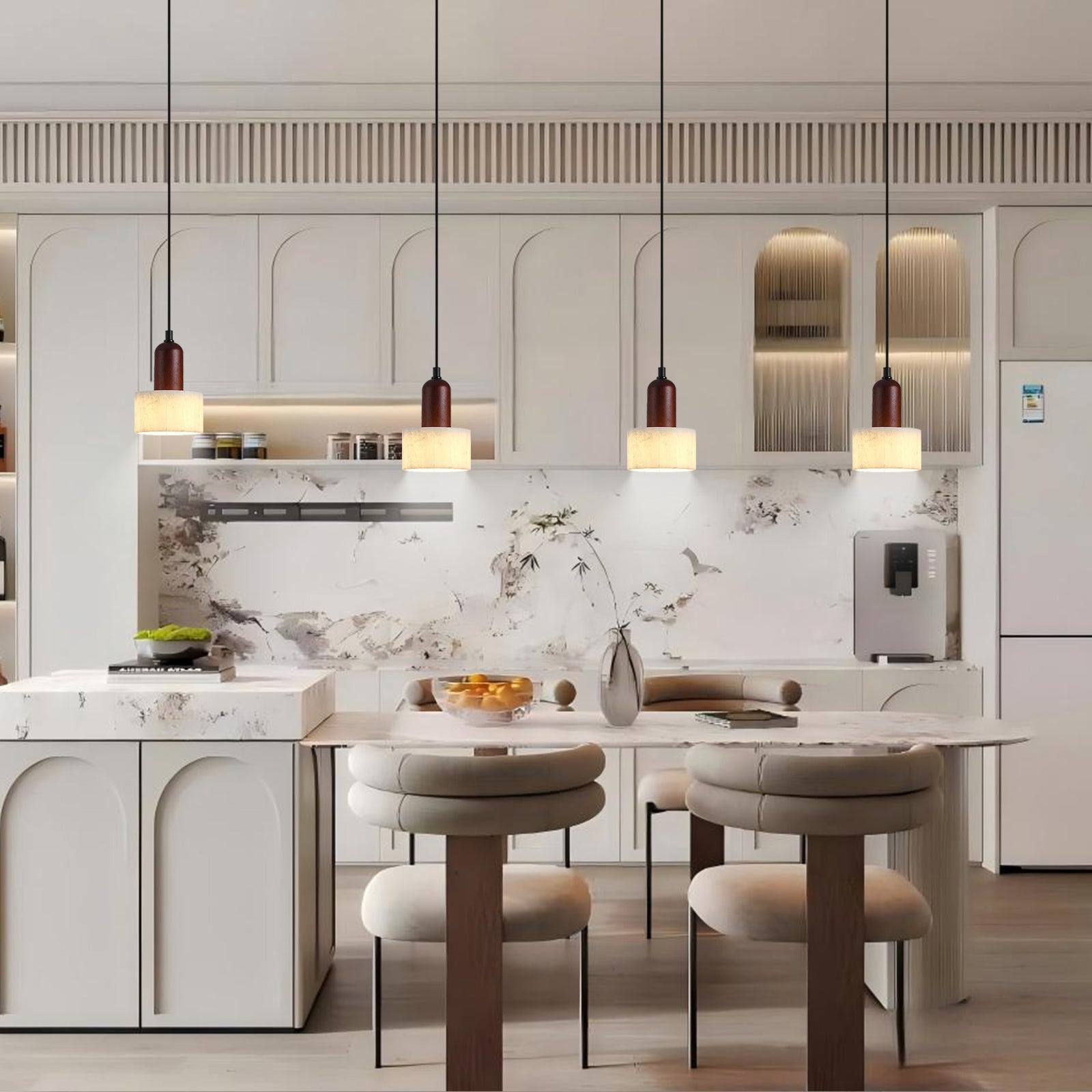 Four marble pendant lights over modern kitchen island.