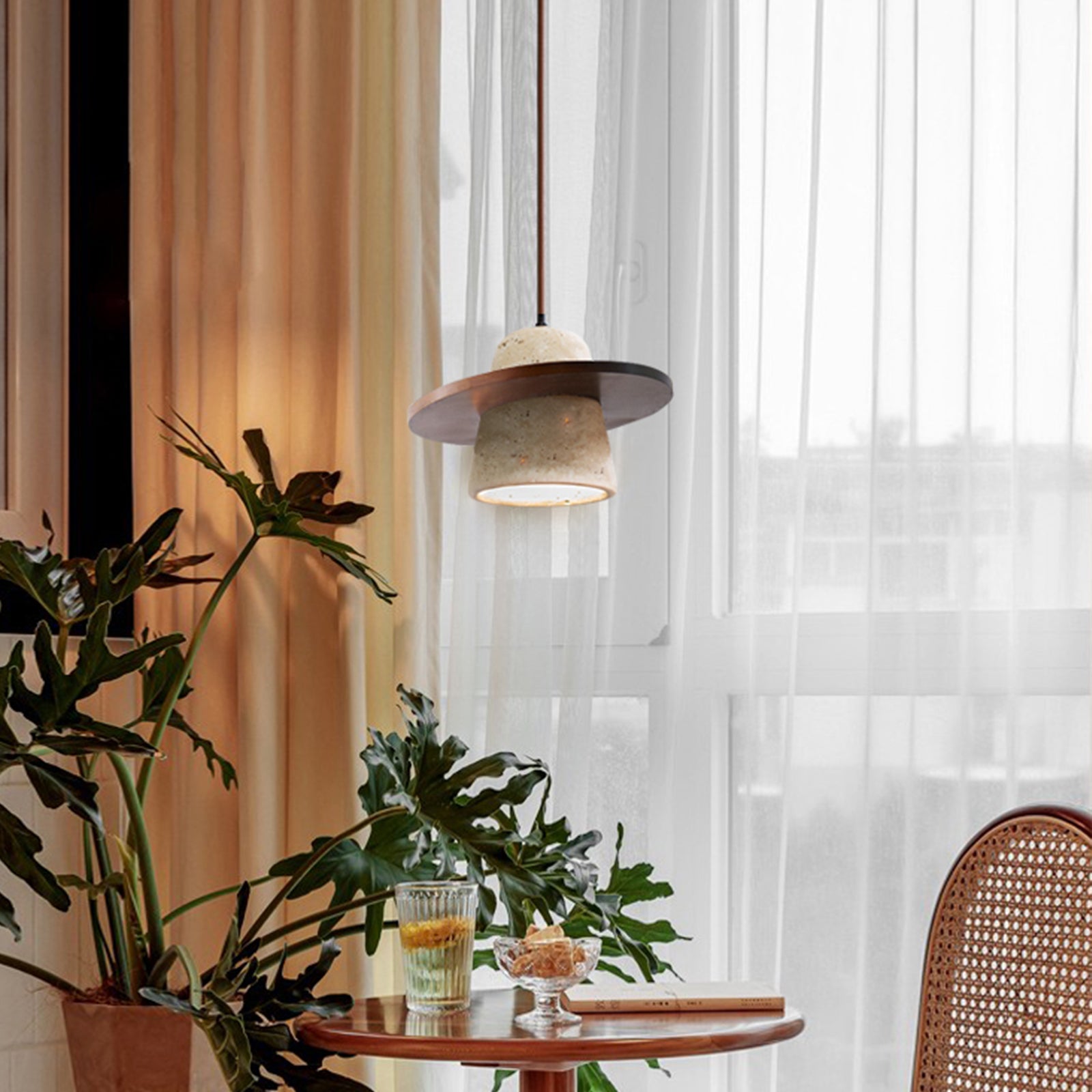 Walnut brown travertine pendant light by window