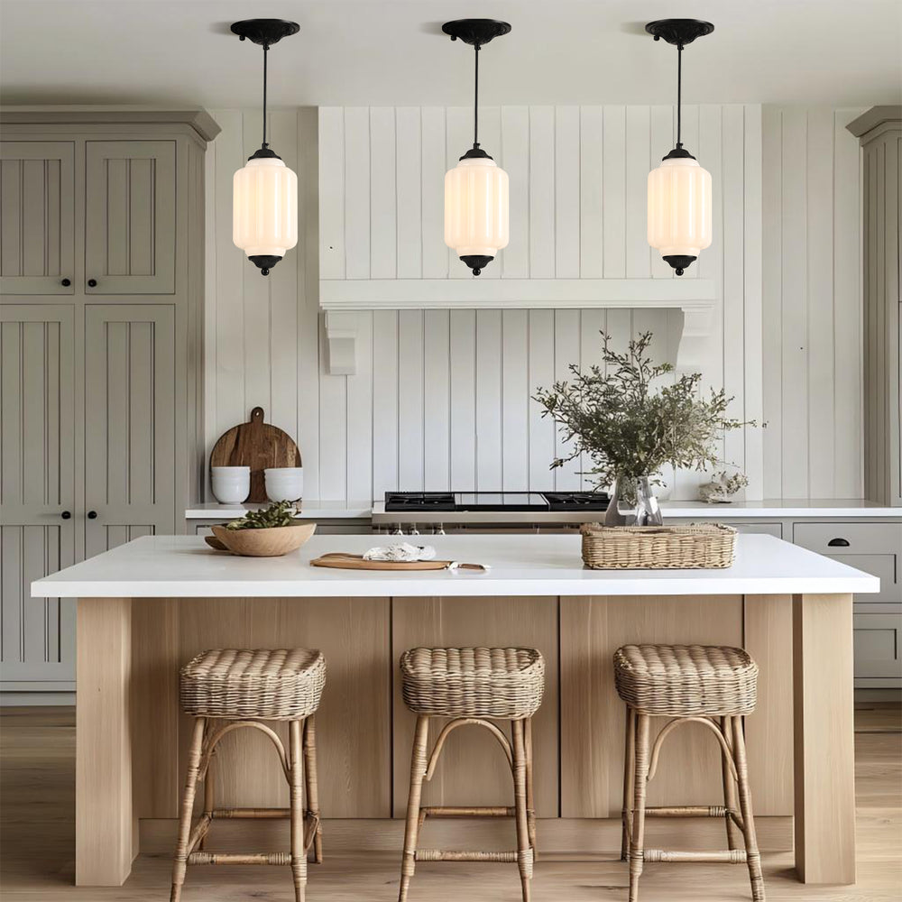 3-pack white glass pendant lights over a modern kitchen island