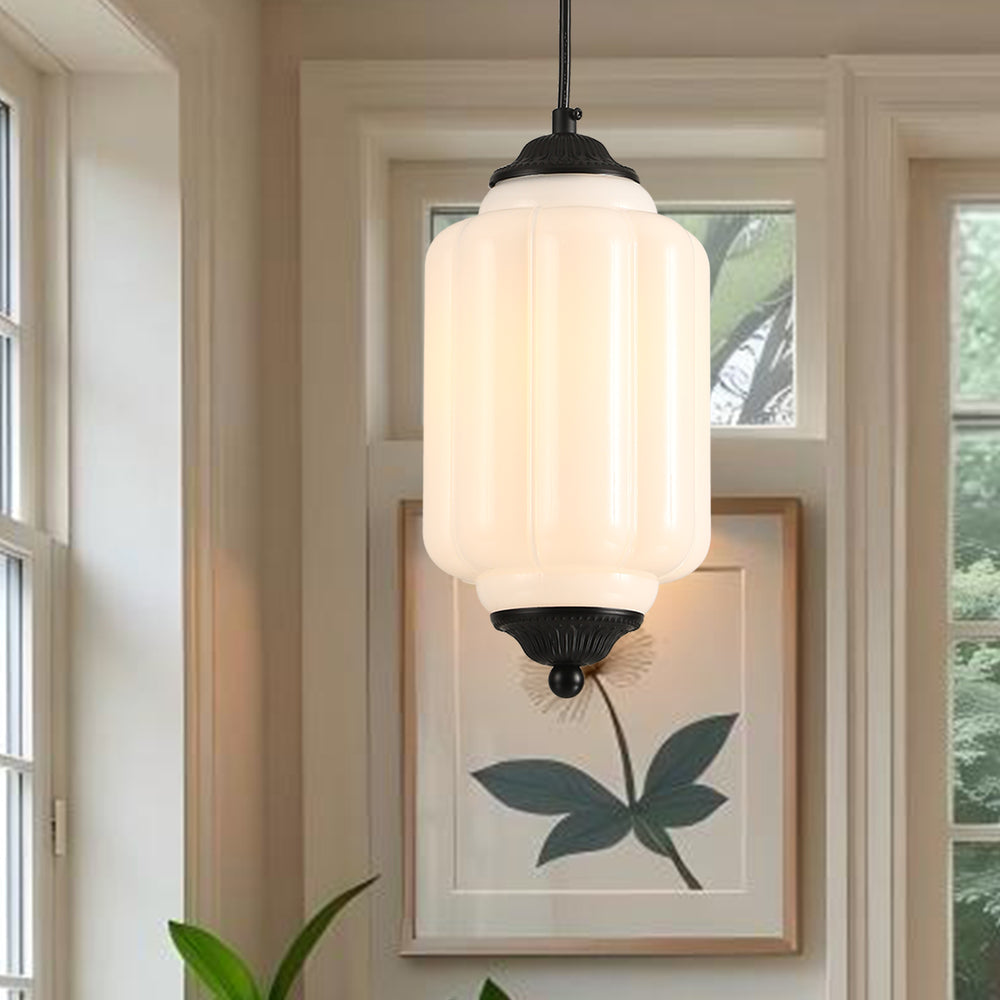 Close-up of white ribbed glass pendant light with black metal fixture