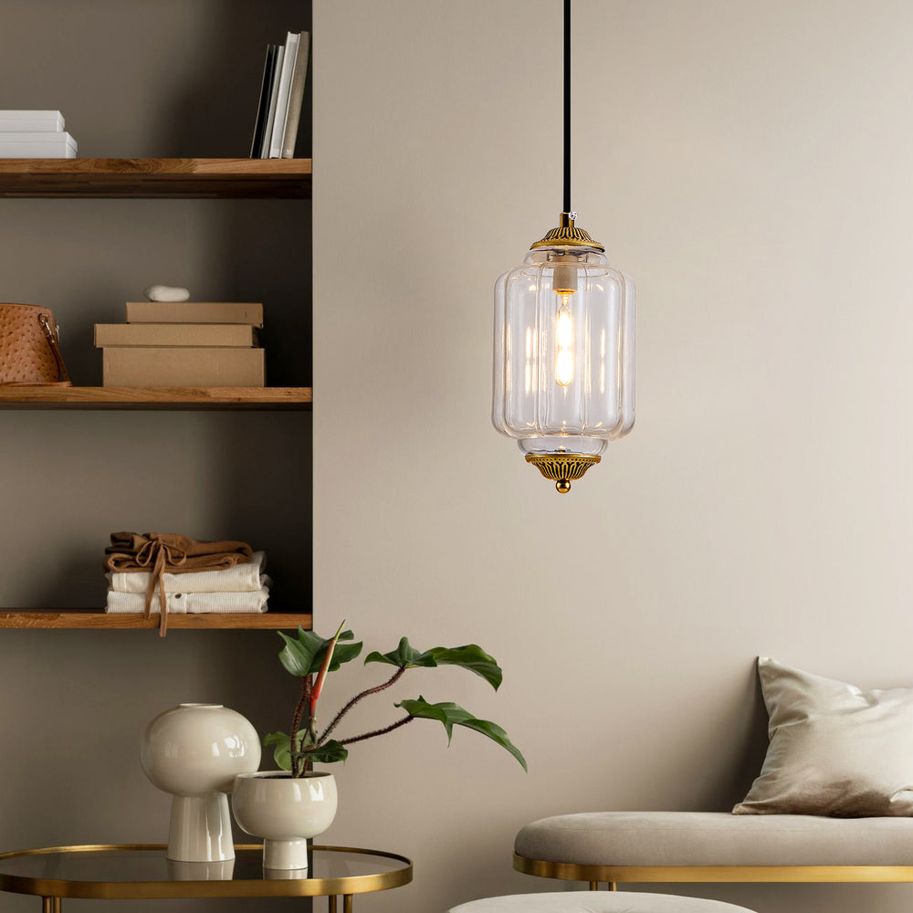 Antique bronze clear glass pendant light in neutral modern living room reading corner